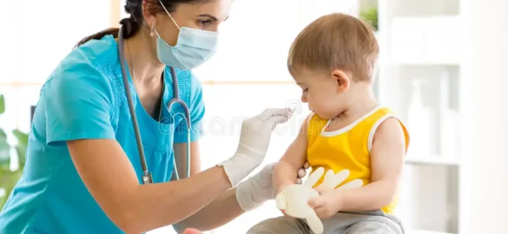 doctor-holds-injection-vaccination-child-pediatric-92961086 doctor-holds-injection-vaccination-child-pediatric-92961086